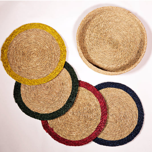 Set of four round mini grasswoven placemats with a pop of colour trim